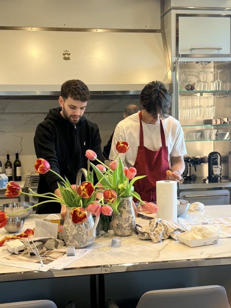 Cooking together in the Palazzo kitchen, tulips on the marble island