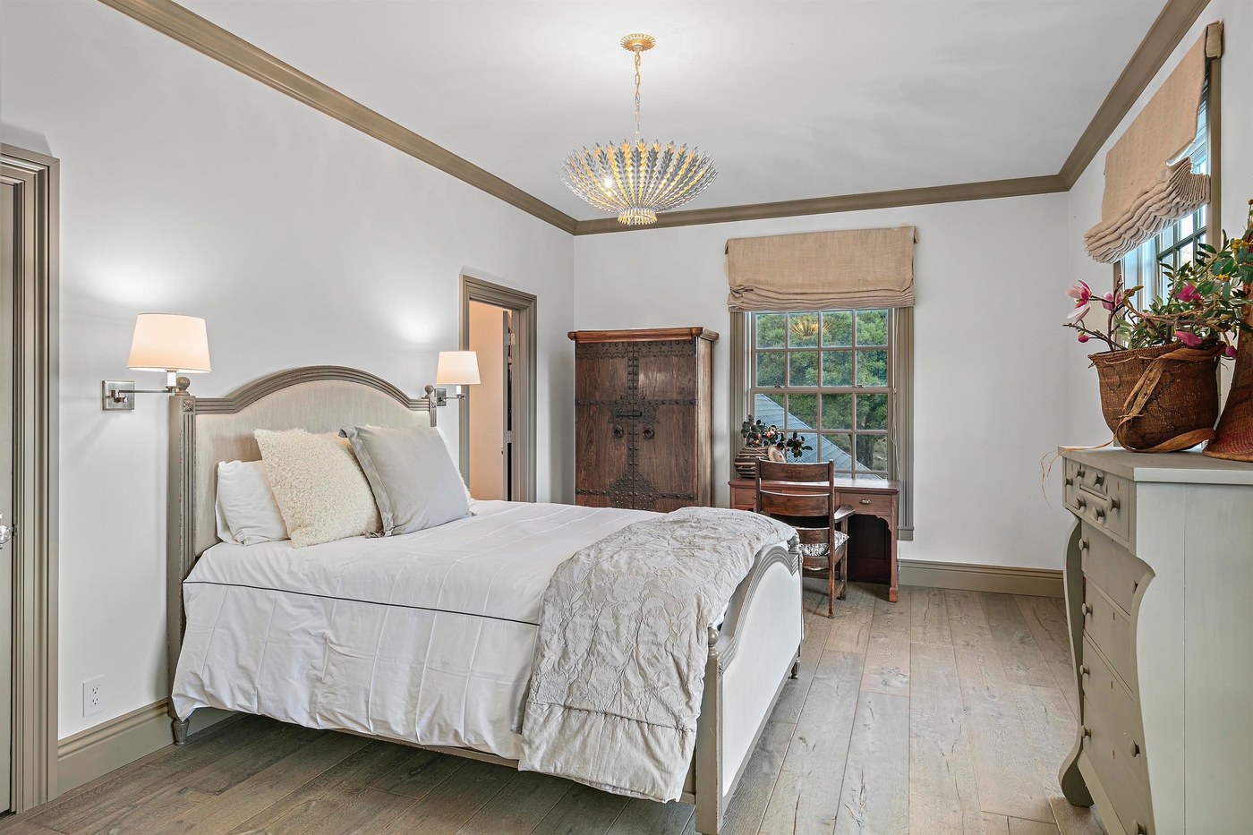 Guest bedroom — king bed with chandelier